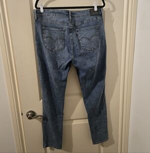 Levi's 721 Lightly Distressed Medium Wash Skinny Jeans